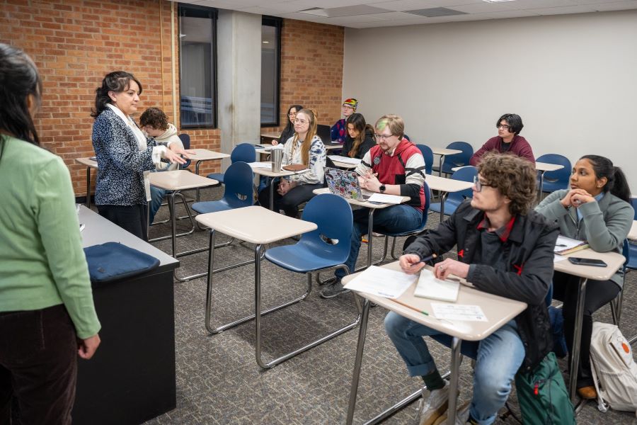 A teacher and a student give a presentation in a classroom at Brookhaven