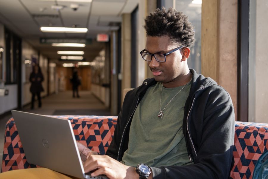 Student studies with a laptop
