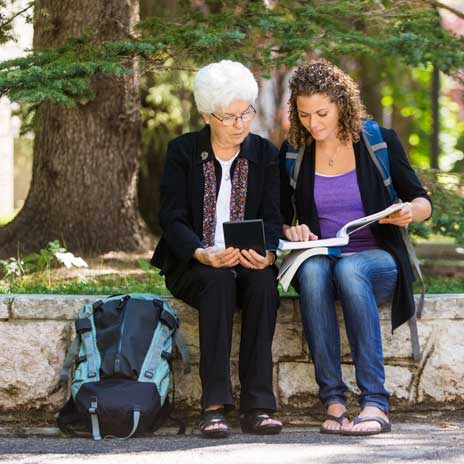 Student helping a disabled person