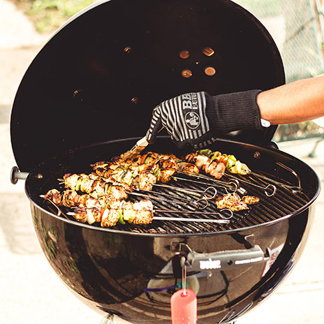 outdoor grill with chicken cooking