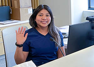 Friendly receptionist waving