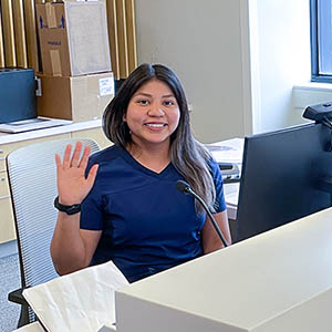 Friendly receptionist waving