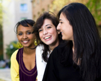 Three students smiling