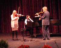 photo of award winners performing music on stage