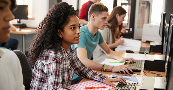 A student works on a laptop