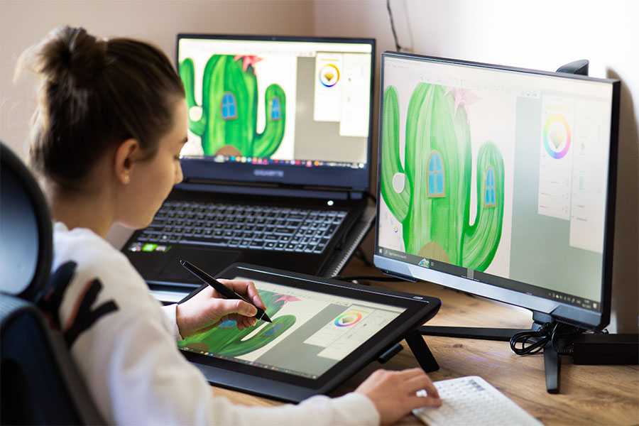 Artist with drawing on a digital tablet