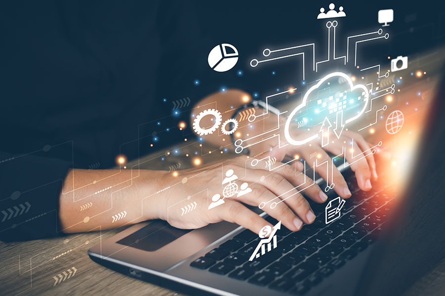 Hands typing on a keyboard with floating icons